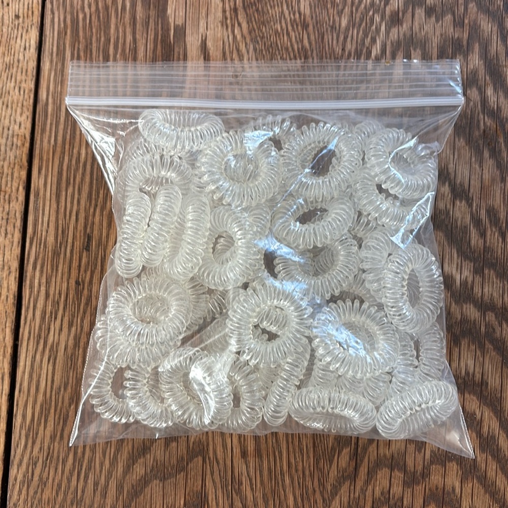 New without tags giant bag of clear spiral hair ties